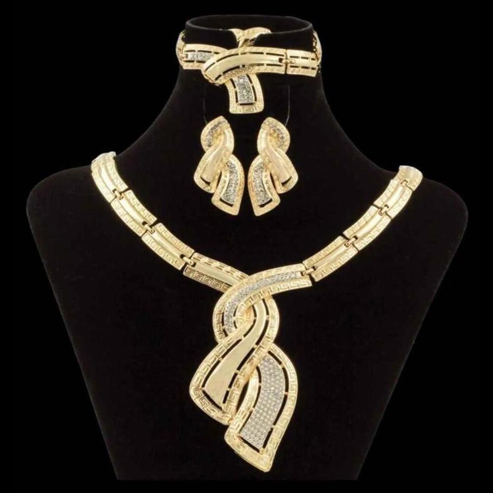 Gold Tone and Clear Stones Necklace, Bracelet, Earrings, and Adjustable Ring Set